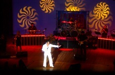 Stage performance under patterned theatrical lighting